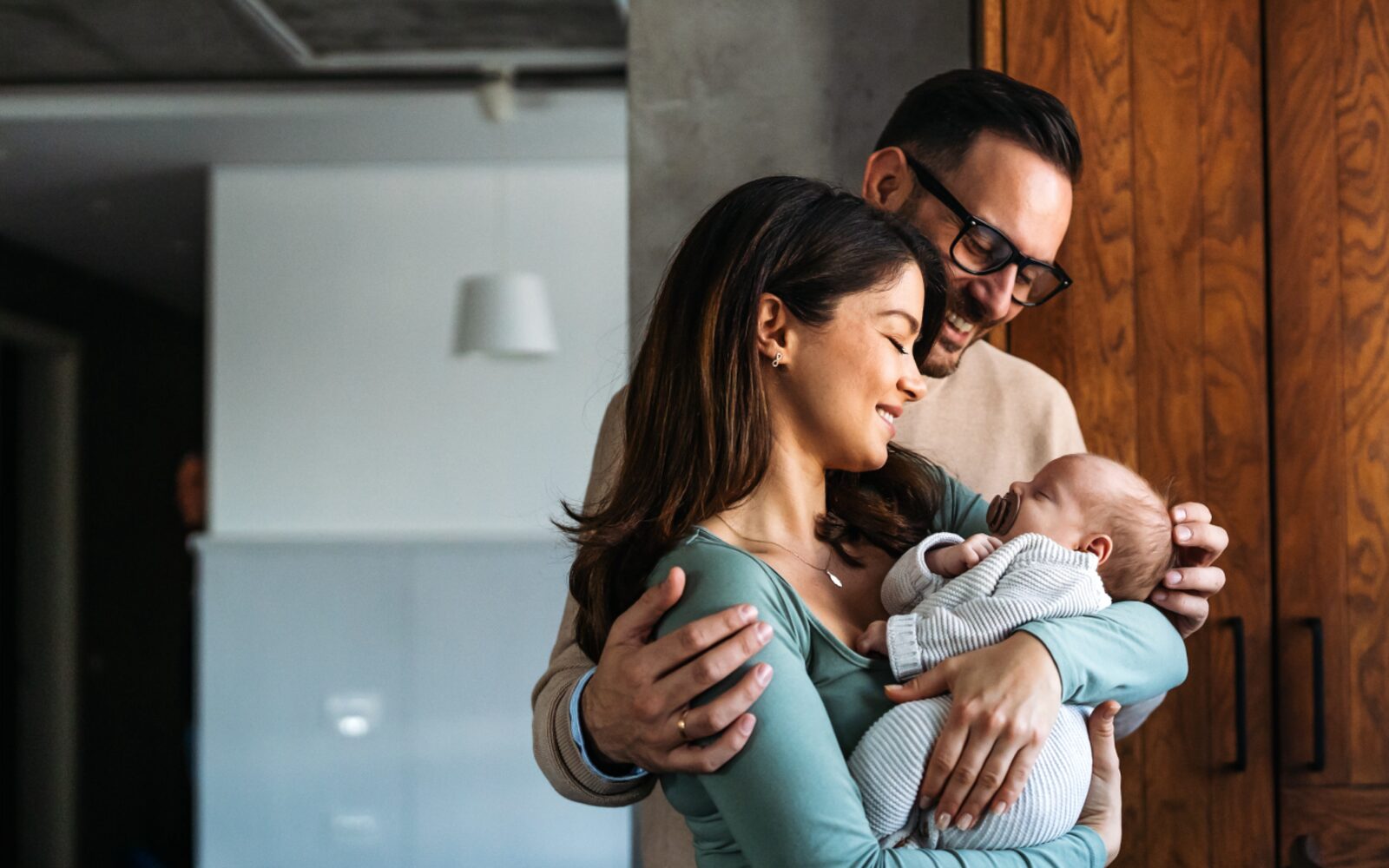 Parents holding their newborn